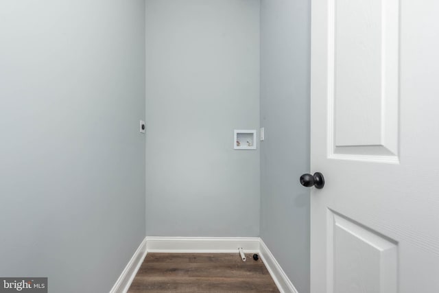 laundry area with dark hardwood / wood-style floors and hookup for a washing machine