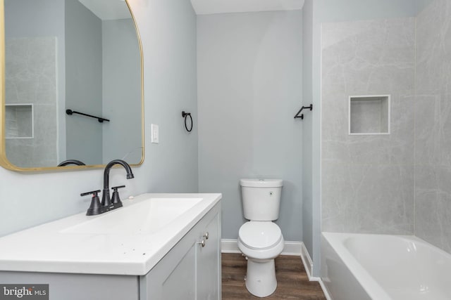 bathroom featuring hardwood / wood-style floors, vanity, and toilet