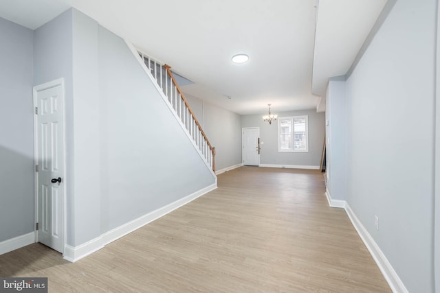 interior space with light hardwood / wood-style flooring and a chandelier