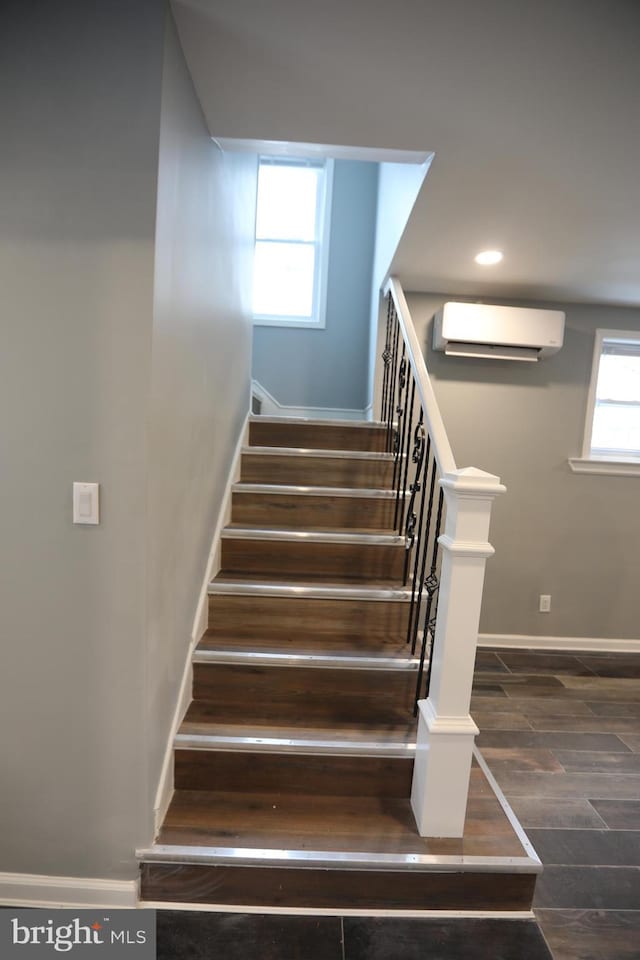 stairway with an AC wall unit