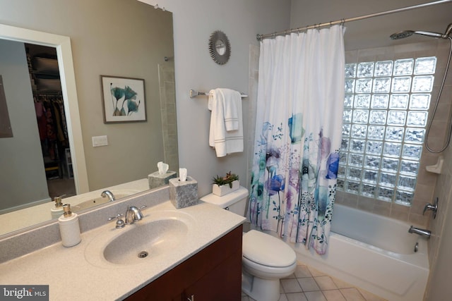 full bathroom featuring toilet, vanity, shower / tub combo with curtain, and tile patterned flooring