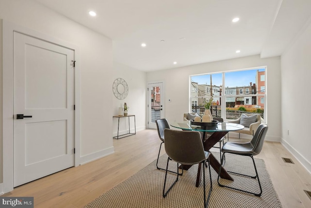 dining space featuring light hardwood / wood-style floors