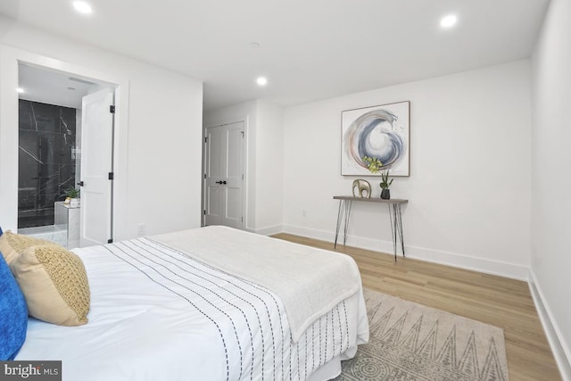 bedroom featuring a closet and light wood-type flooring