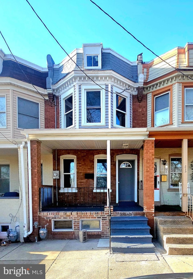 view of property with a porch