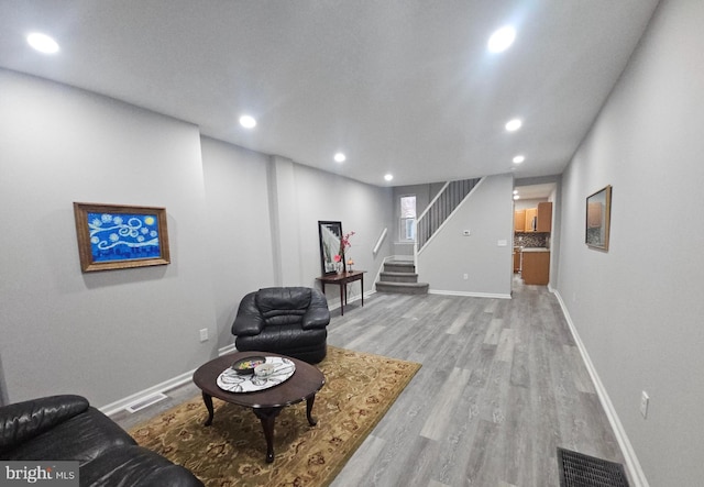 sitting room featuring light hardwood / wood-style floors