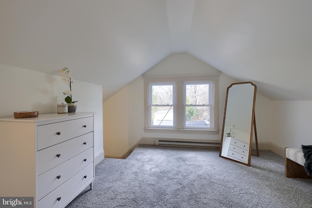 additional living space featuring lofted ceiling, light carpet, and a baseboard radiator