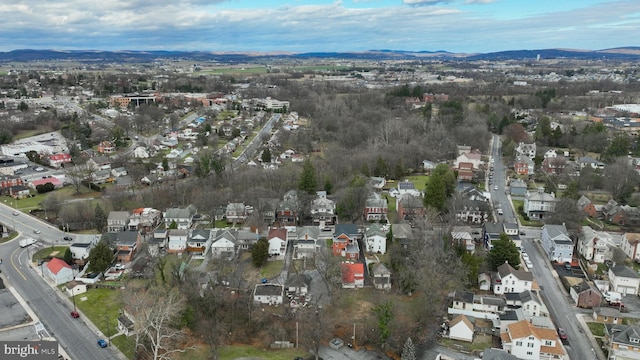 birds eye view of property featuring a mountain view