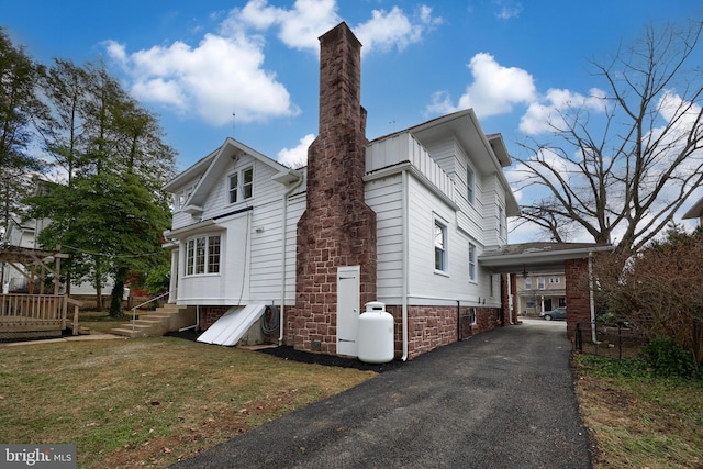 view of property exterior featuring a lawn