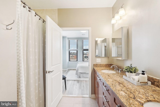 bathroom with tile patterned flooring and vanity