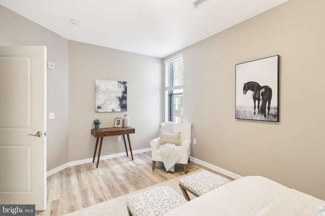 sitting room featuring light hardwood / wood-style floors