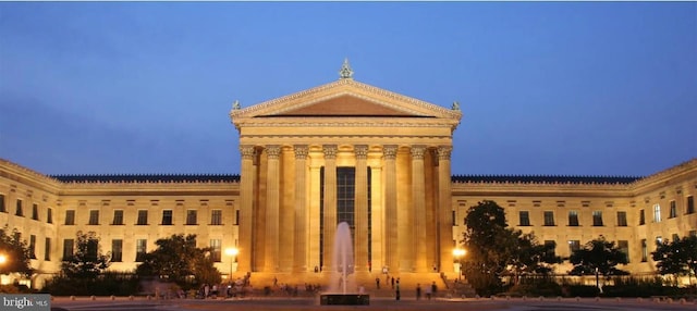 view of outdoor building at dusk