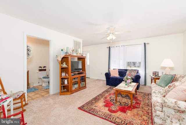 633 E Main St, Fruitland, MD 21826 - living area featuring carpet flooring, a ceiling fan, and baseboards