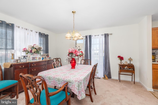 633 E Main St, Fruitland, MD 21826 - dining area featuring light colored carpet, a notable chandelier, and baseboards
