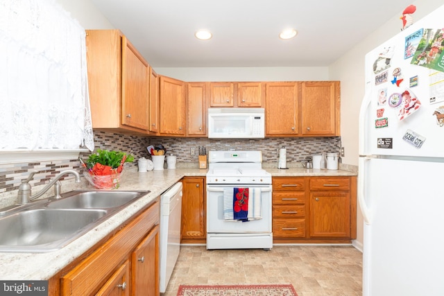 633 E Main St, Fruitland, MD 21826 - kitchen featuring recessed lighting, light countertops, decorative backsplash, a sink, and white appliances