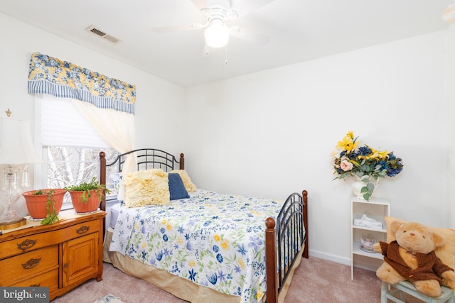 633 E Main St, Fruitland, MD 21826 - bedroom featuring baseboards, ceiling fan, visible vents, and light colored carpet