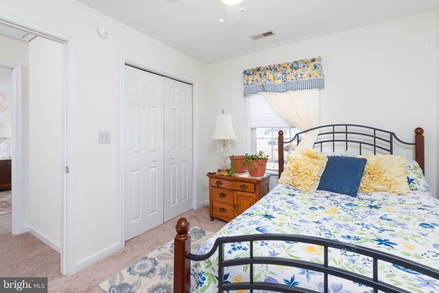 633 E Main St, Fruitland, MD 21826 - bedroom featuring ceiling fan, light colored carpet, visible vents, baseboards, and a closet