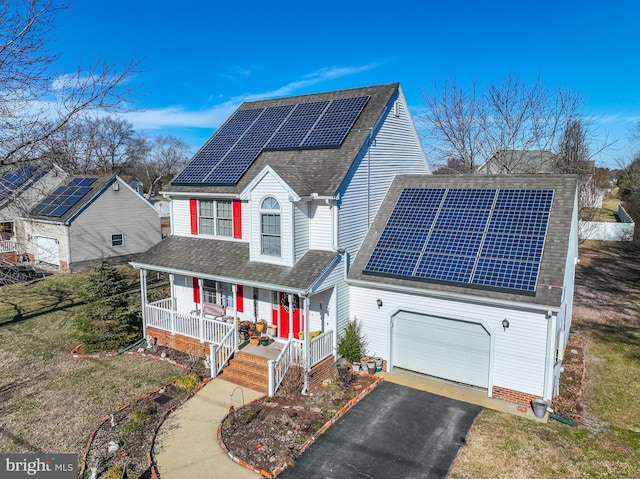 633 E Main St, Fruitland, MD 21826 - traditional-style home with a porch, solar panels, a shingled roof, and aphalt driveway