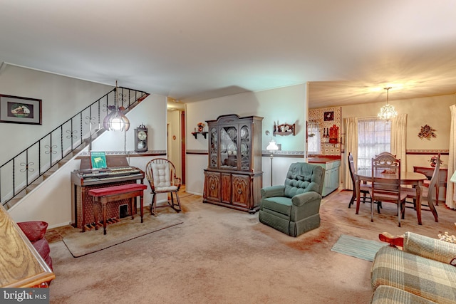 living room with carpet flooring and a chandelier