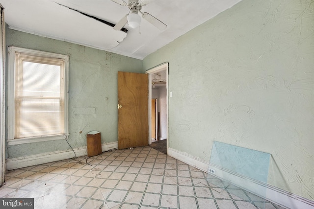 unfurnished room featuring ceiling fan