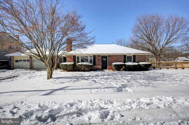 ranch-style house featuring a garage