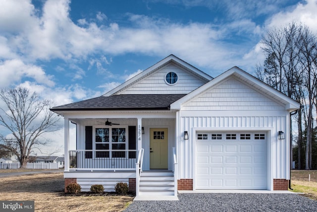 view of front of house featuring covered porch, ceiling fan, and a garage