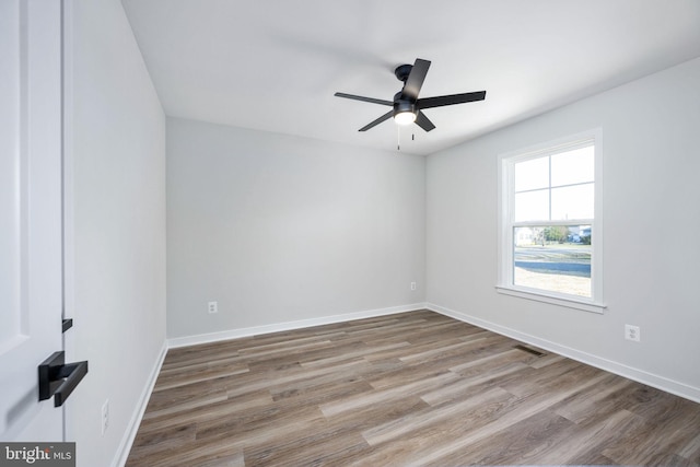 unfurnished room featuring ceiling fan and light wood-type flooring