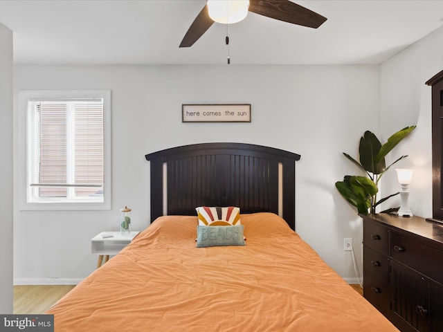 bedroom featuring ceiling fan and light hardwood / wood-style floors