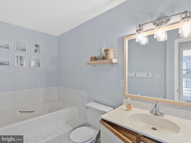 bathroom featuring vanity, toilet, and tiled tub