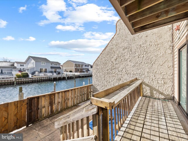 wooden terrace with a water view