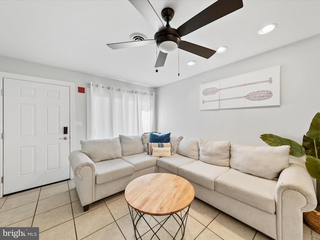 tiled living room featuring ceiling fan