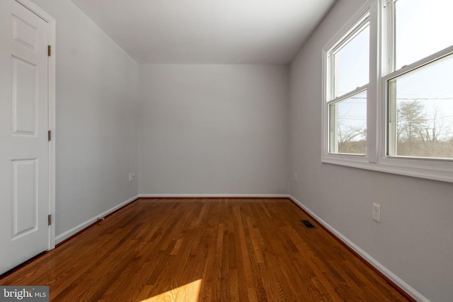 bonus room featuring dark hardwood / wood-style flooring