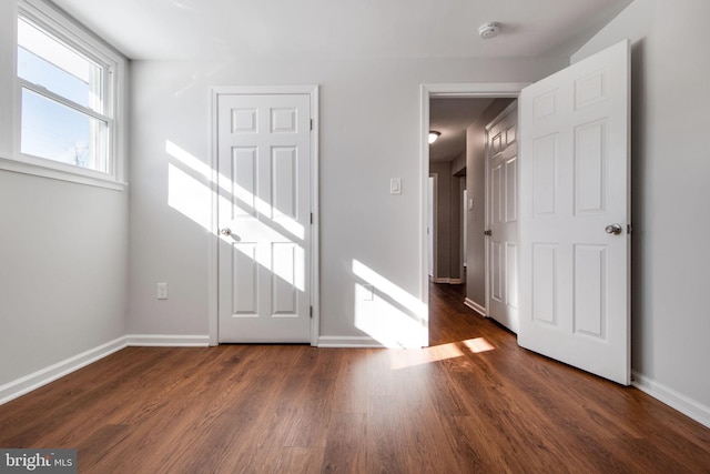 interior space with dark hardwood / wood-style flooring