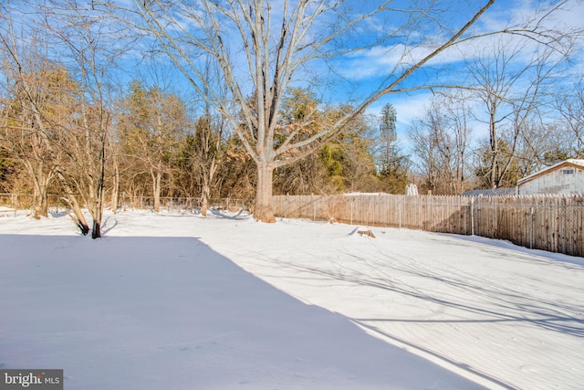 view of yard covered in snow