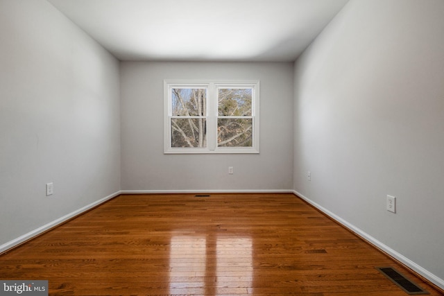 empty room featuring hardwood / wood-style floors