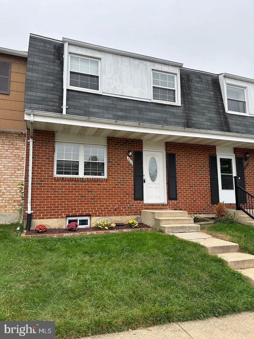 view of property with a front lawn