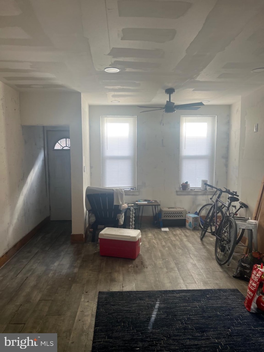 interior space featuring ceiling fan, hardwood / wood-style floors, and plenty of natural light