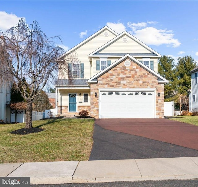 view of front of property with a garage and a front yard