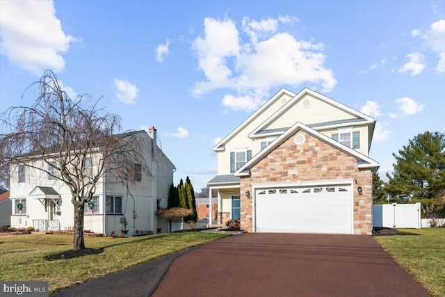 view of front of property with a front yard and a garage