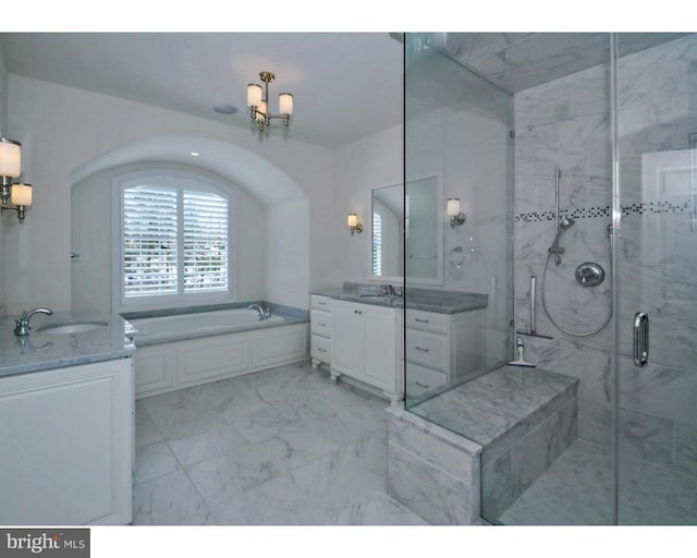 bathroom featuring vanity and separate shower and tub