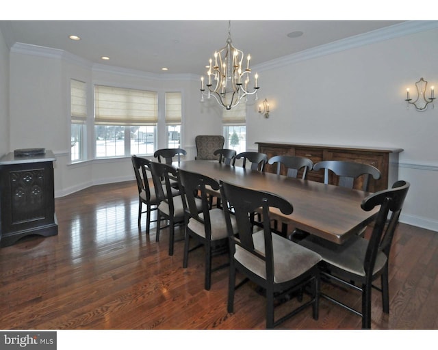 dining room with dark hardwood / wood-style flooring, an inviting chandelier, and ornamental molding