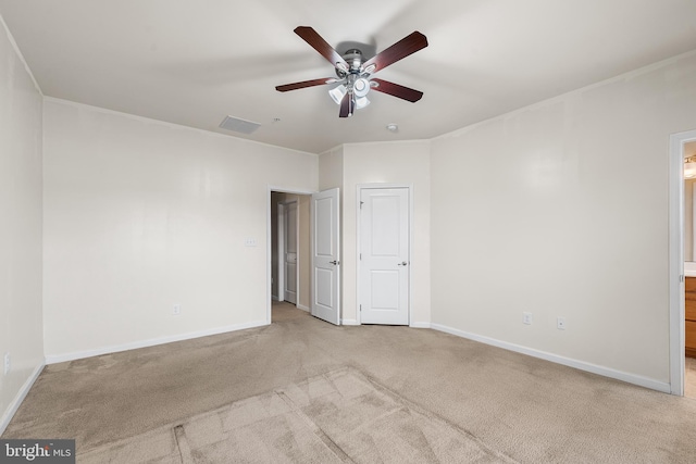 carpeted spare room with ceiling fan