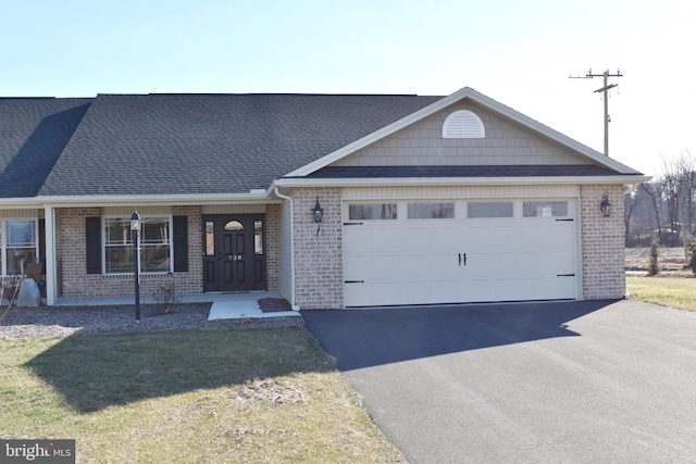 view of front of property with a porch and a garage