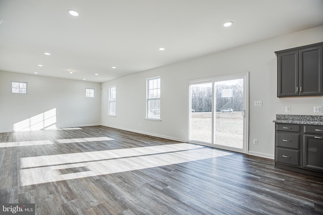 unfurnished living room featuring hardwood / wood-style floors