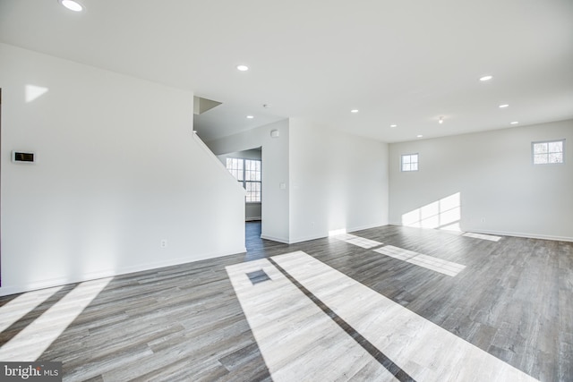 spare room with light hardwood / wood-style floors and a wealth of natural light