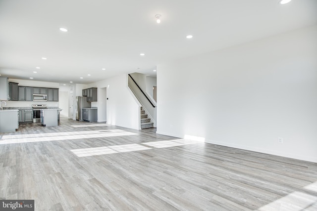 unfurnished living room featuring light hardwood / wood-style floors