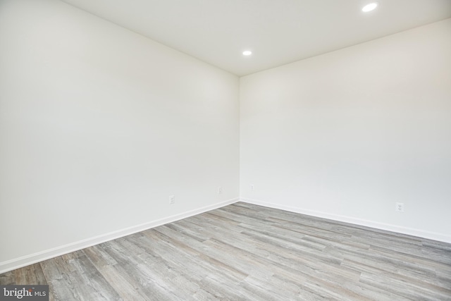 spare room with light wood-type flooring