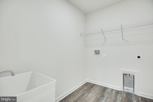 washroom featuring washer hookup, dark wood-type flooring, electric dryer hookup, and sink