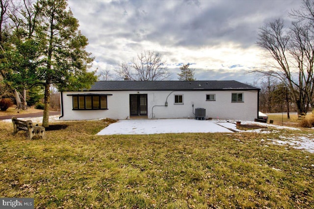 back of house featuring a yard, central AC, and a patio area