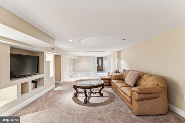 living room with built in shelves and carpet floors