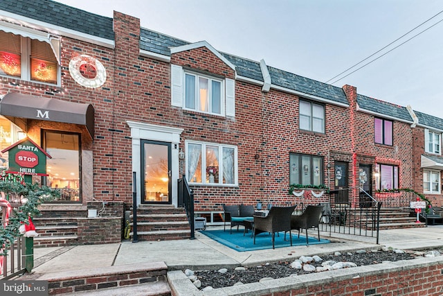 rear view of house featuring a patio